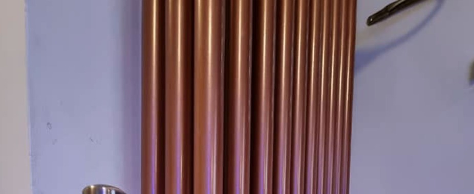 A copper column radiator installed by SMC in a Cardiff home